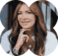 A woman with long hair and a white shirt.