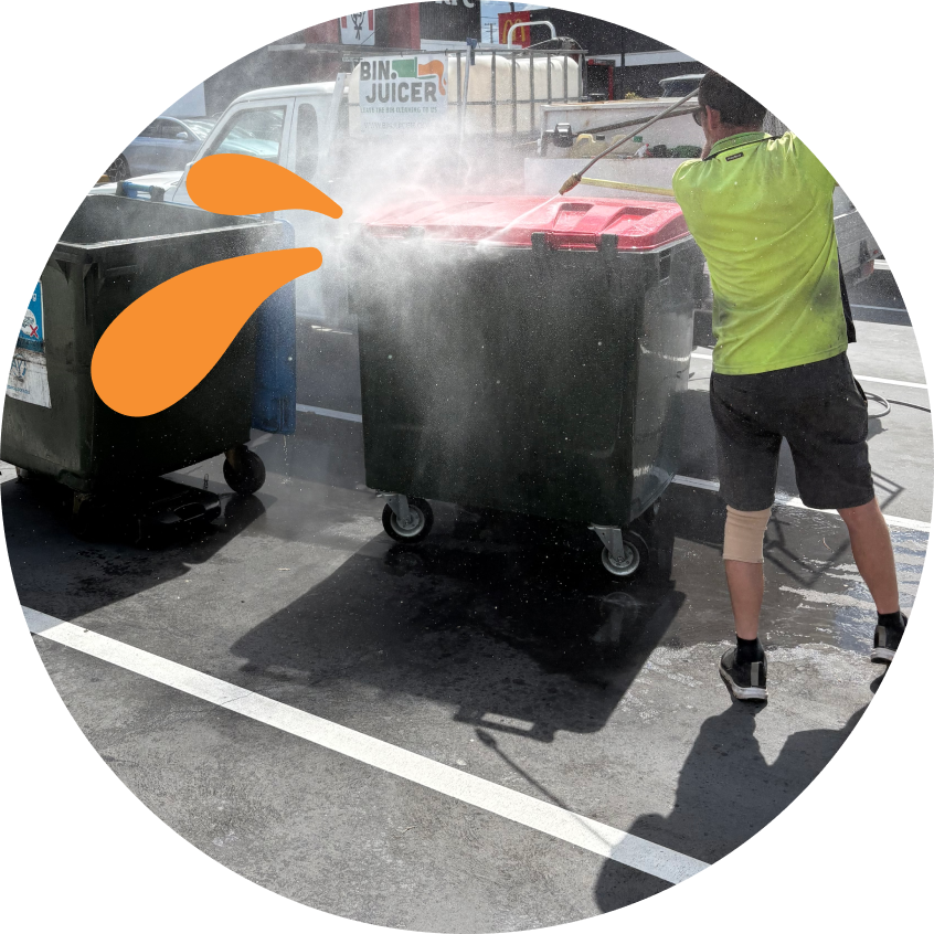 Bin Juicer employee cleaning bin