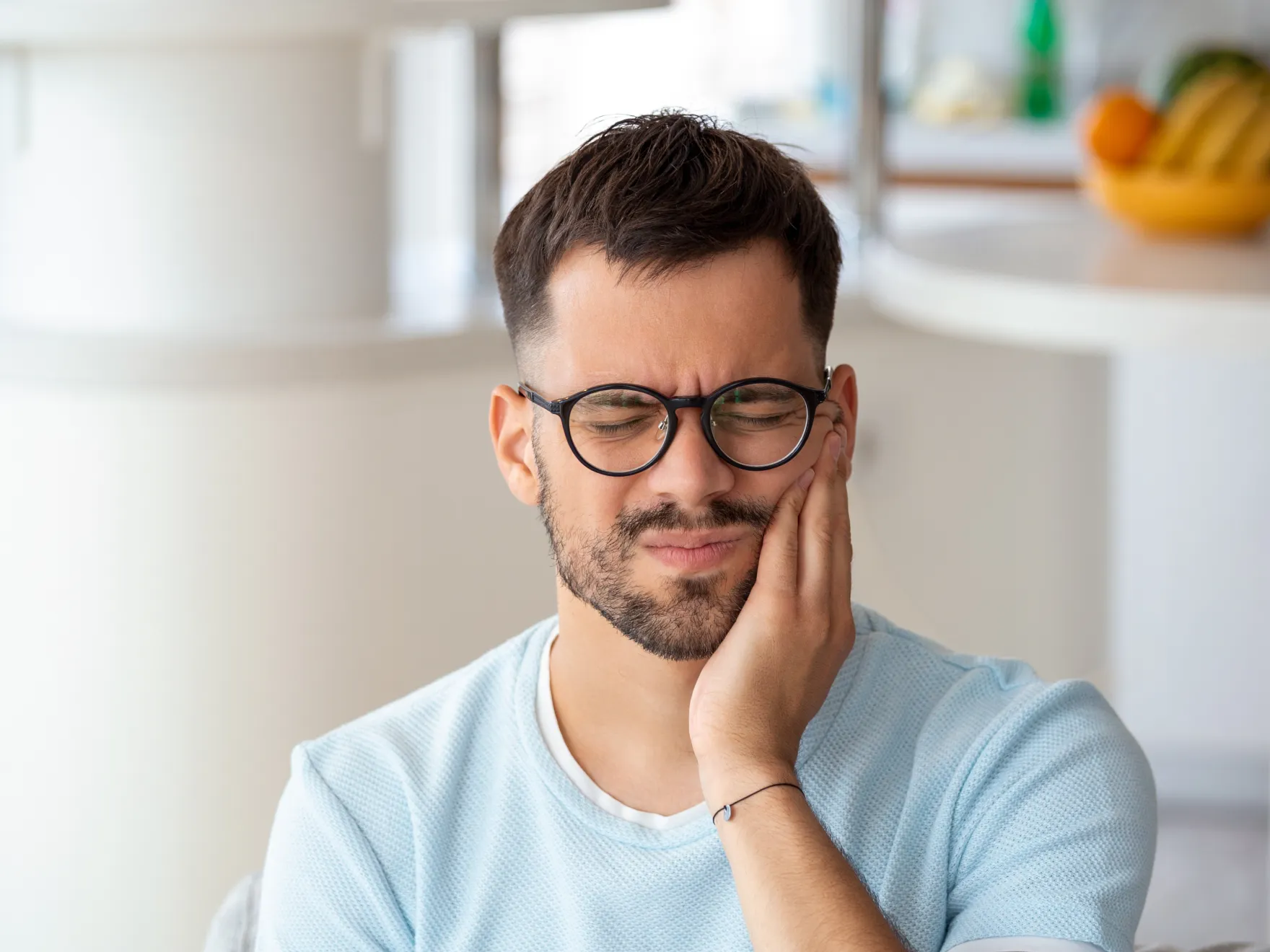 A man with glasses is looking at something.