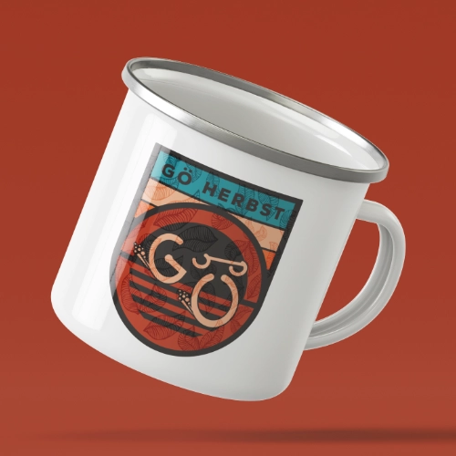 Crest design for Gö Herbst with autumn colours and a G and Ö joined to look like a gravel bike.