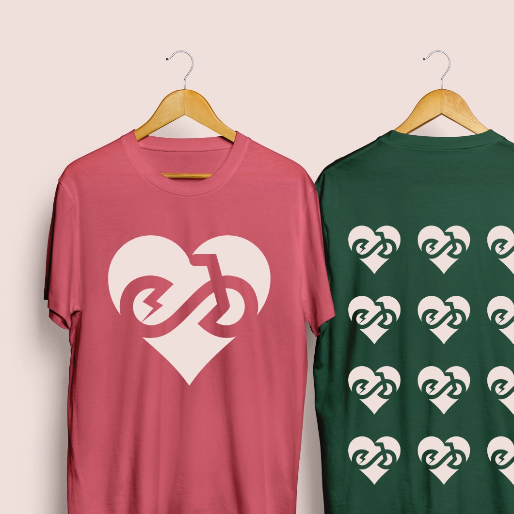 Love Ebikes logo, a negative space e and b together forming a bike shape inside a heart. The logo is printed on a mug.