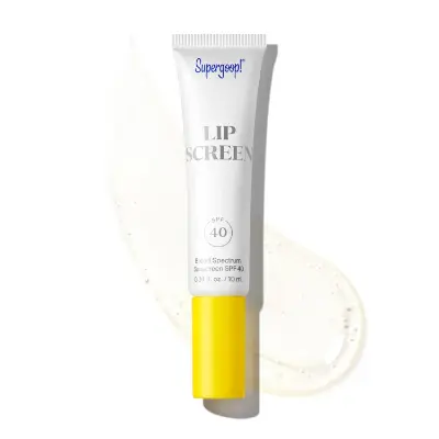 Supergoop Lipscreen SPF 40 lip gloss sunscreen tube with yellow cap on white and beige background