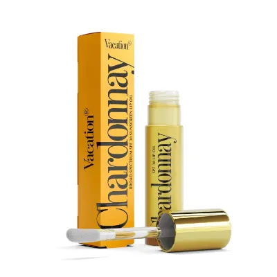 Vacation Chardonnay Lip Oil SPF 30 hydrating lip sunscreen with doe-foot applicator bottle on white background