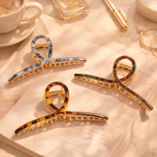 Large metal hair claw clips for everyday securing of various hair types.