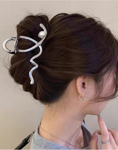 Silver wave-shaped large metal hair clips for sculptural Y2K updo styles