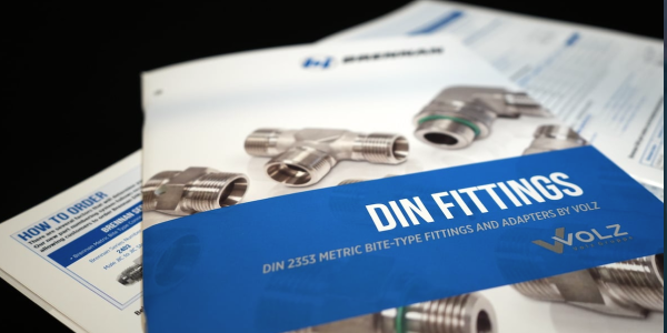 Brochure cover displaying metal DIN fittings and adapters with bold title 'DIN FITTINGS'.