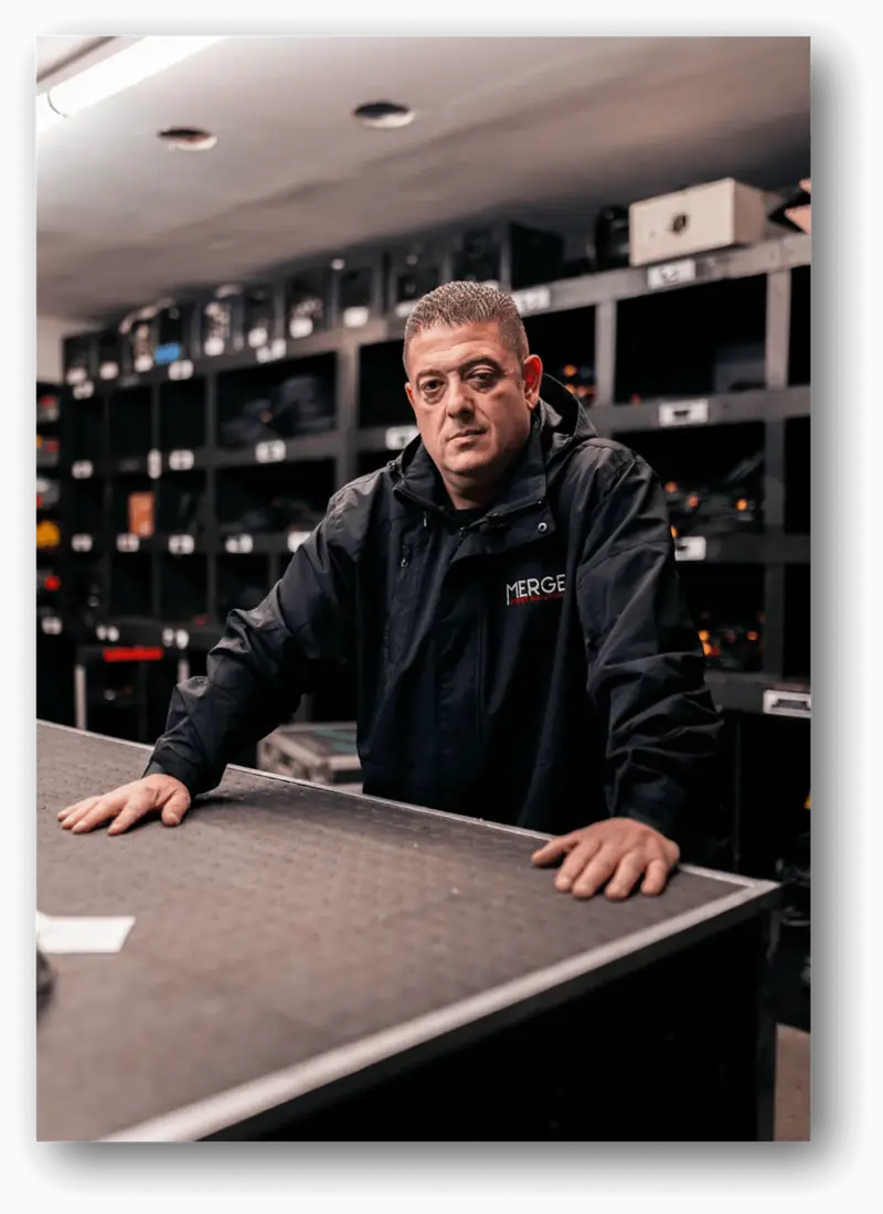 Massimo DiDonna at an equipment table in an event production warehouse
