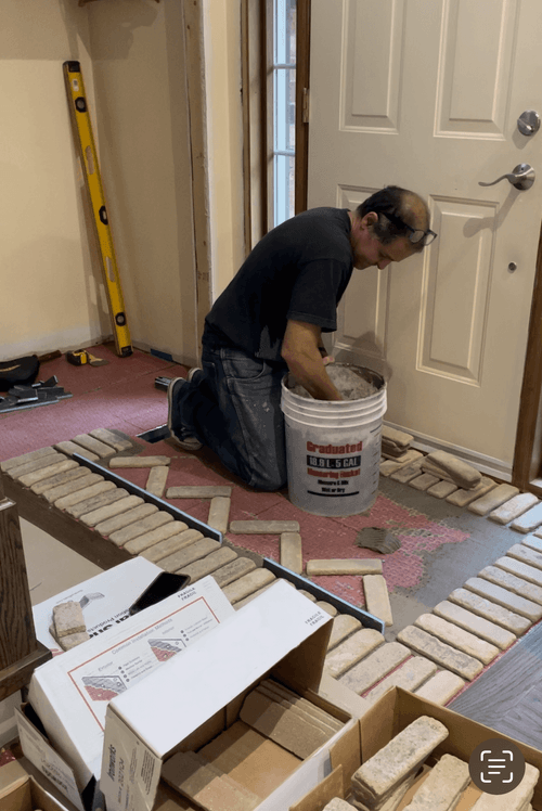 Crafting Elegance: Stone Design Being Created and Installed at Front Door Entrance