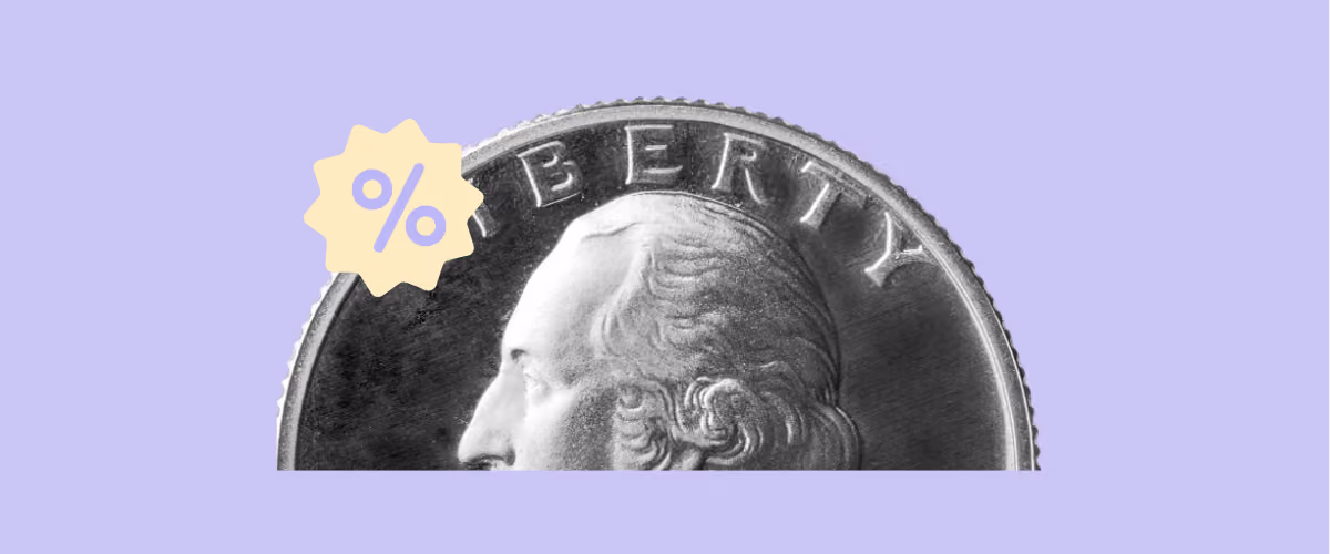 Close-up of a quarter coin with a yellow percent badge on lavender