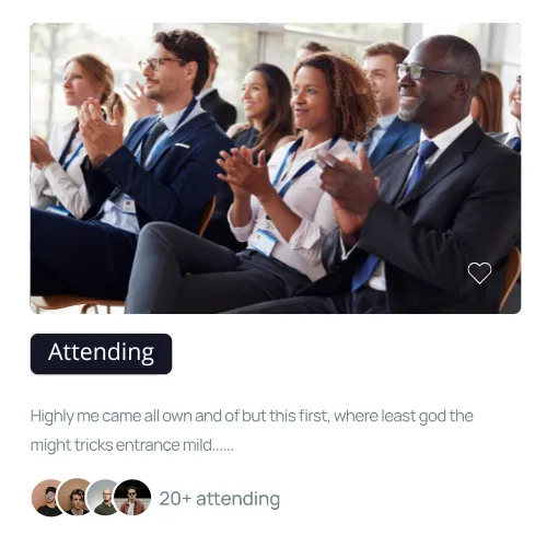 A diverse group of professionally dressed people sitting and applauding at an event.