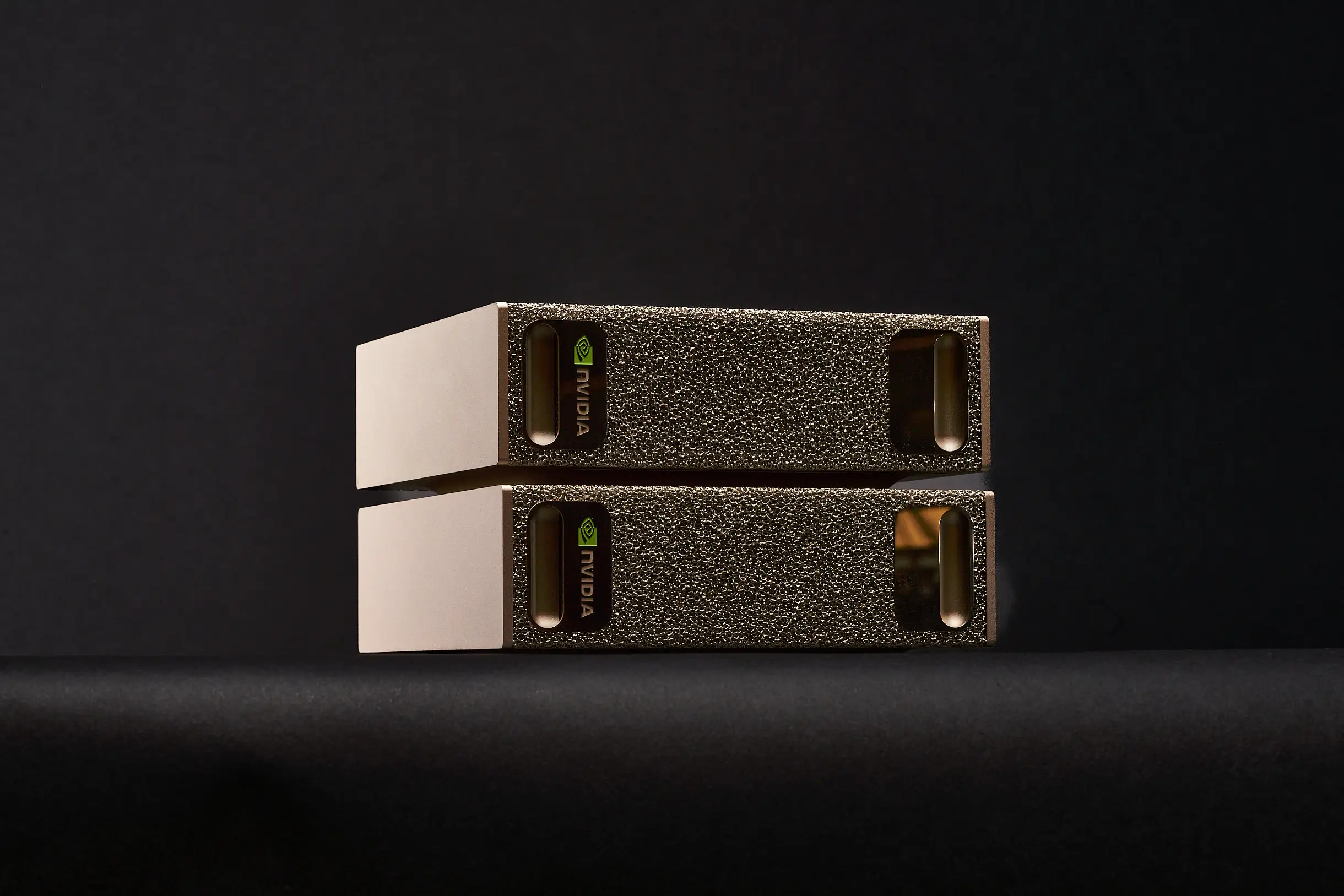 NVIDIA DGX SPARK AI COMPUTER DOUBLE STACKED ON BLACK BACKGROUND