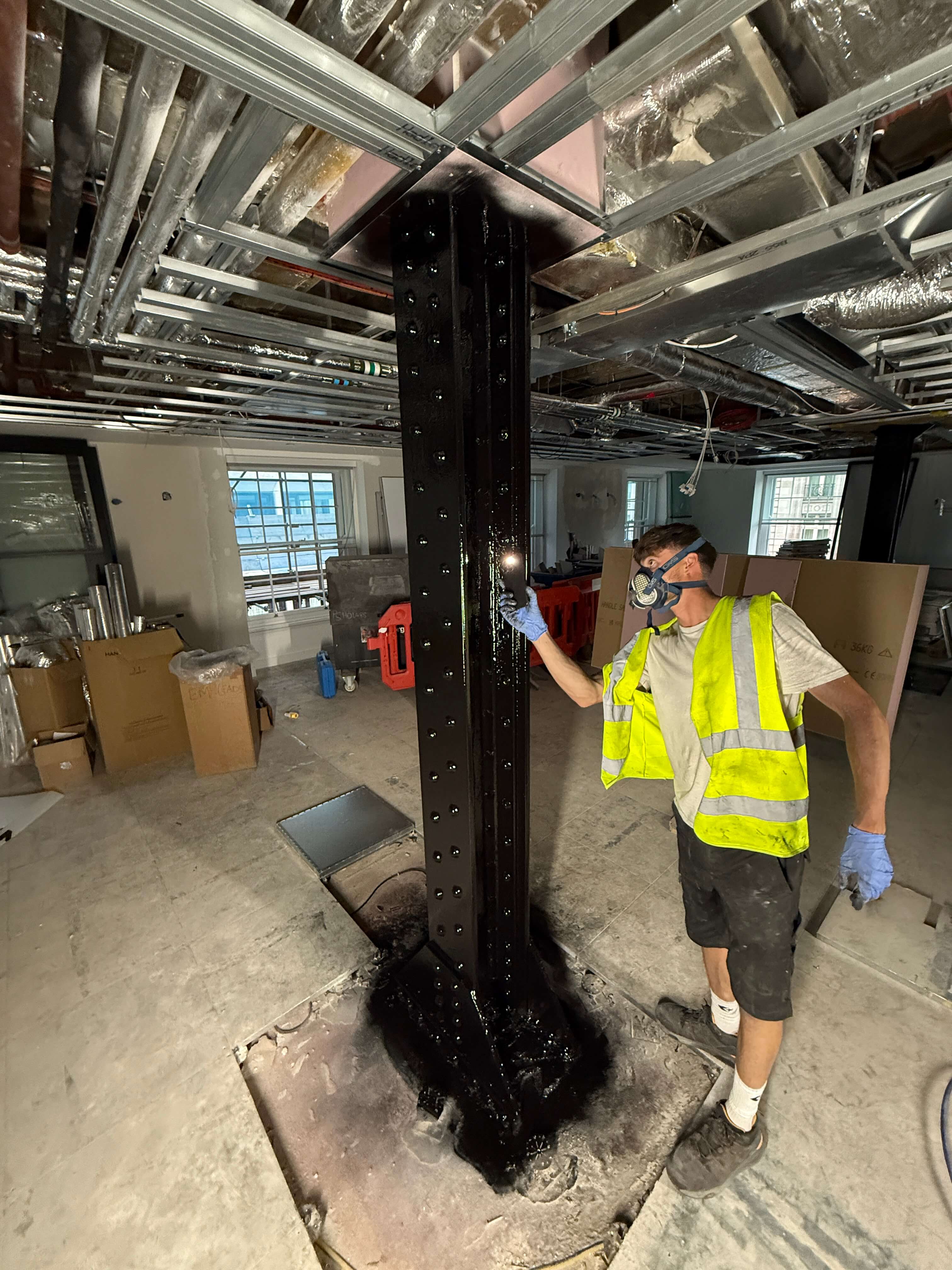 inspecting black flame retardant top coat after application