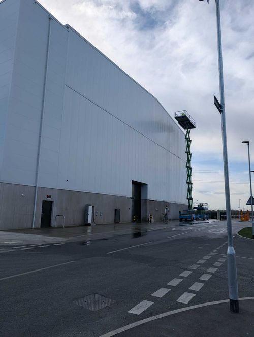 High-performance coatings applied to film studio exterior for durability.