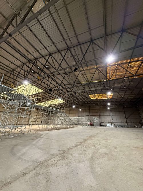 Health and safety briefing before skylight spray painting begins.