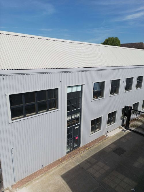 Operative cleaning window frames before spray application.