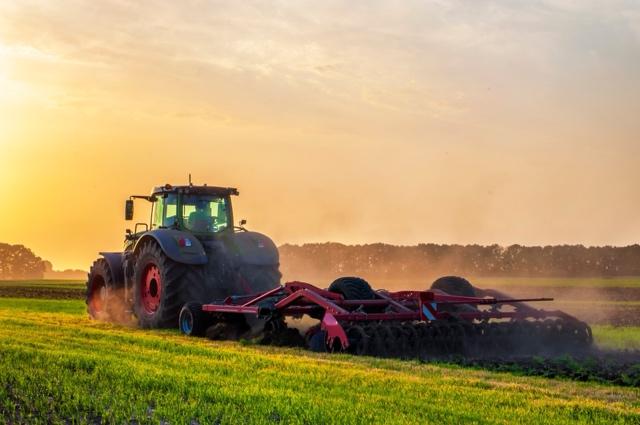 A tractor in a fieldDescription automatically generated