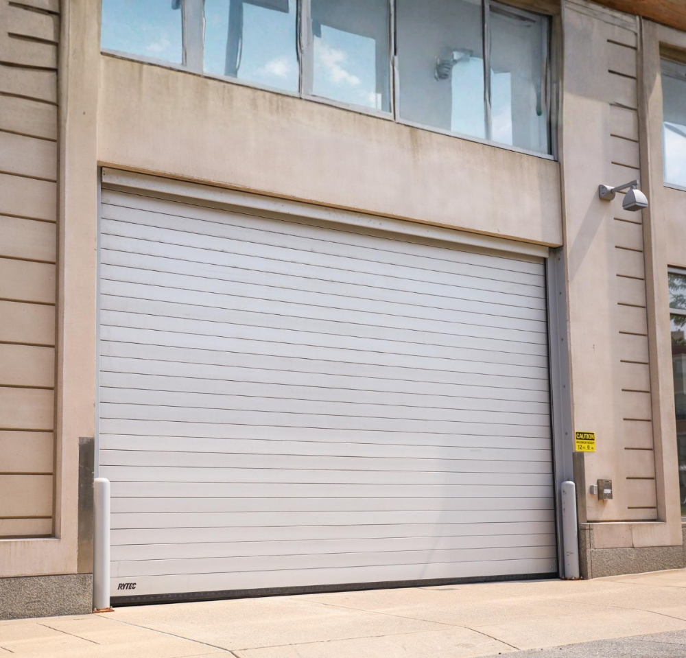 White Commercial Roll Up Garage Door on Building