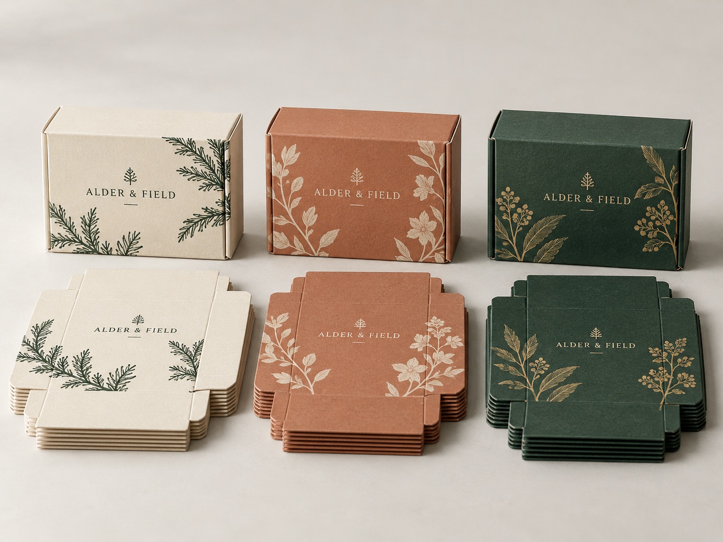 Three small carton batches with different artwork and matching flat packaging
