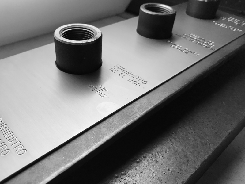 A photo of an engraved data plate in B&W