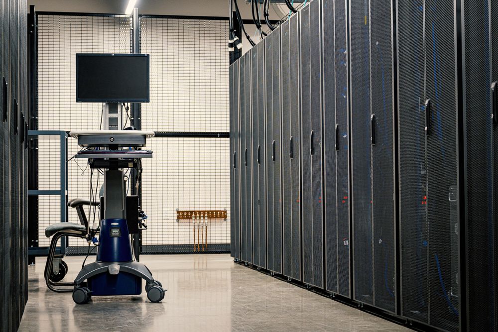 Data center corridor with rows of server racks