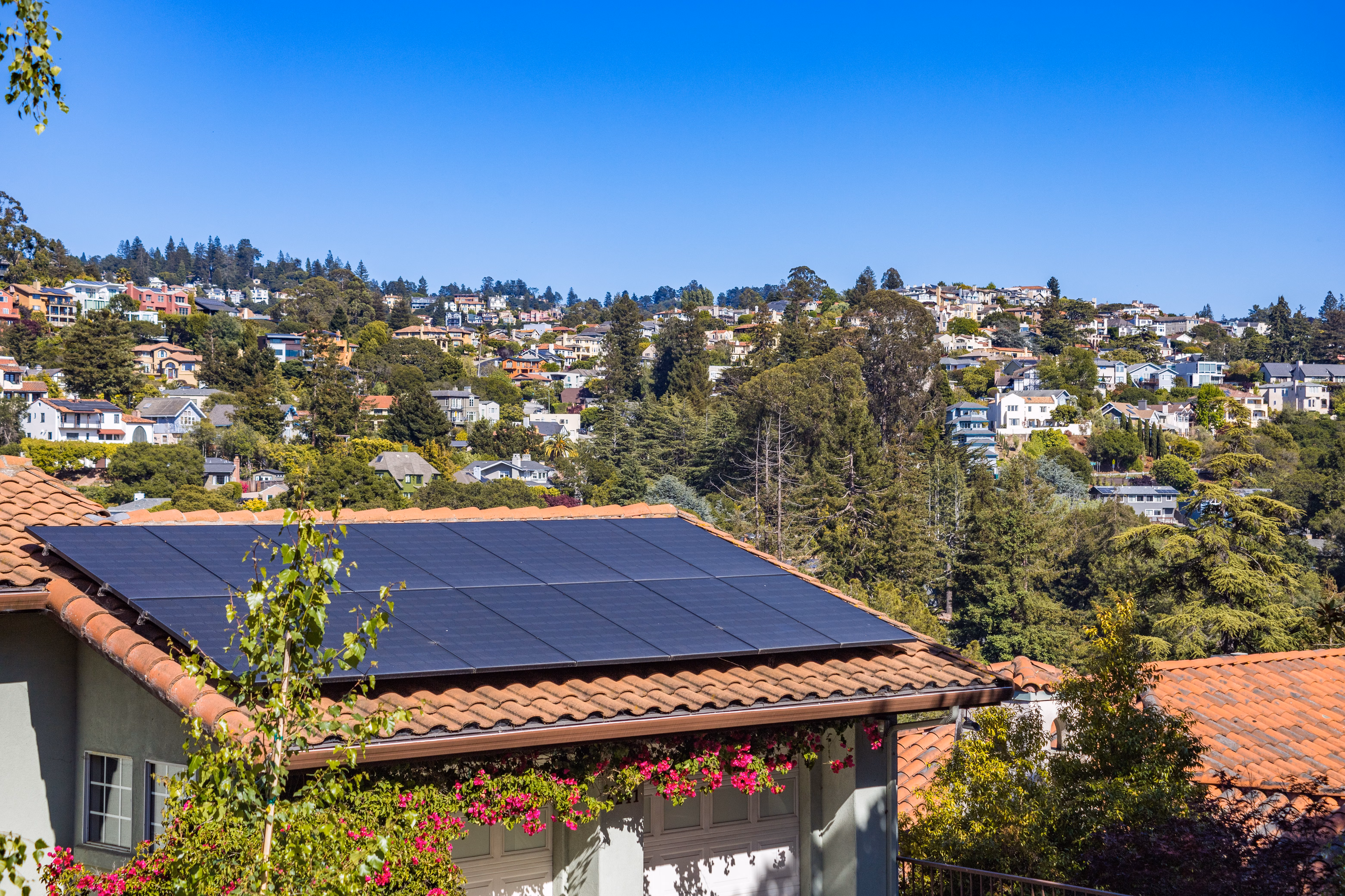 Solar panels installed on the roof of a suburban home