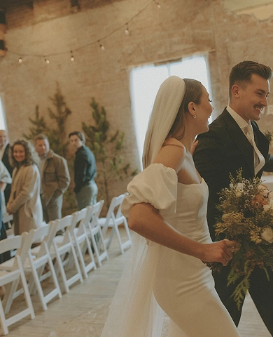 couple coming down the isle after ceremony