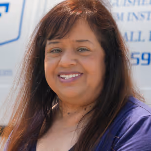 A photo of Becky Pruszynski smiling.