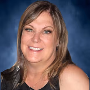 A photo of Kathy Martinez smiling.