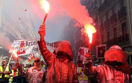 Protestors holding flares