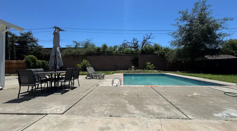 Pool · Fenced Yard · Garage · Tree-Lined Street