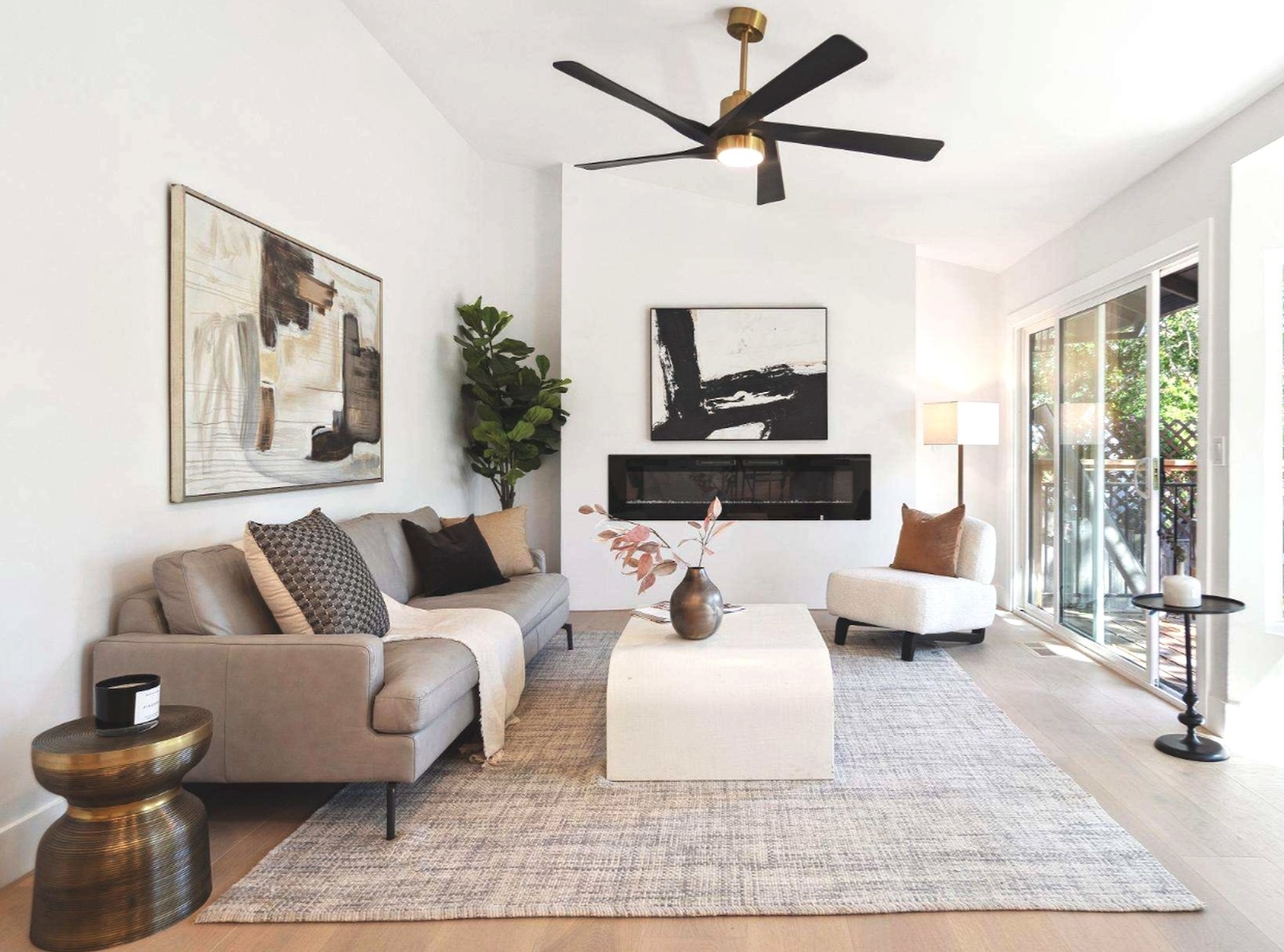 Refined living room with fireplace staged by Only Stagers