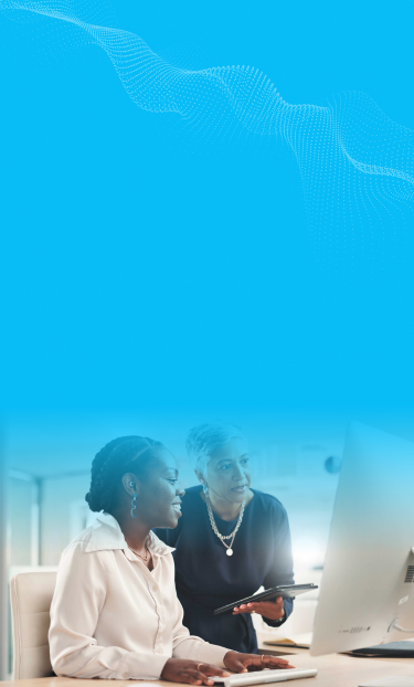 Two women using a computer