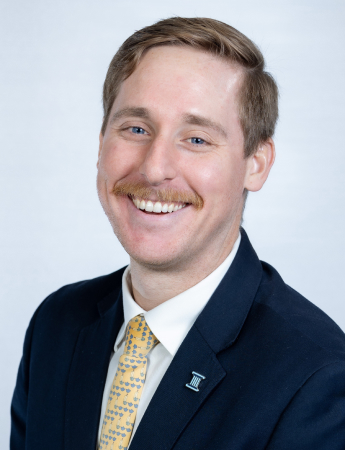 A professional headshot of Bishop Golden, a Wealth Administrator at First Carolina Wealth. He is smiling slightly and looking directly at the camera.