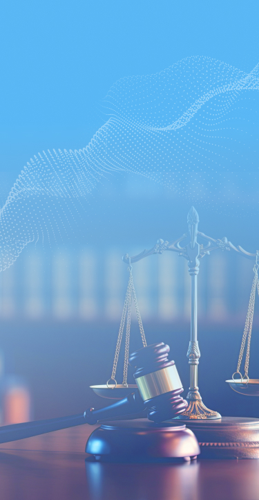 A legal scale and has a gavel in front of it.