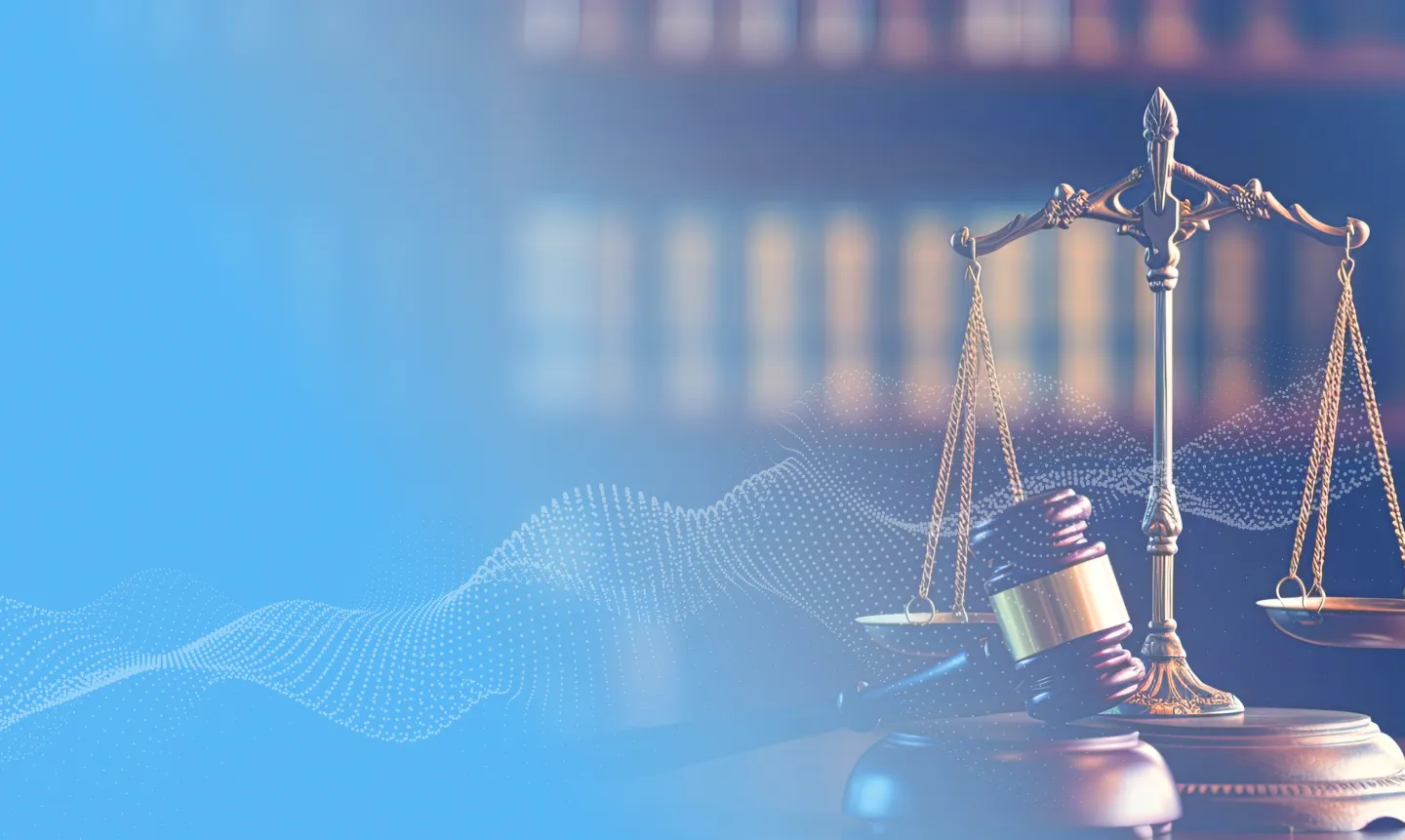 A legal scale and has a gavel in front of it.