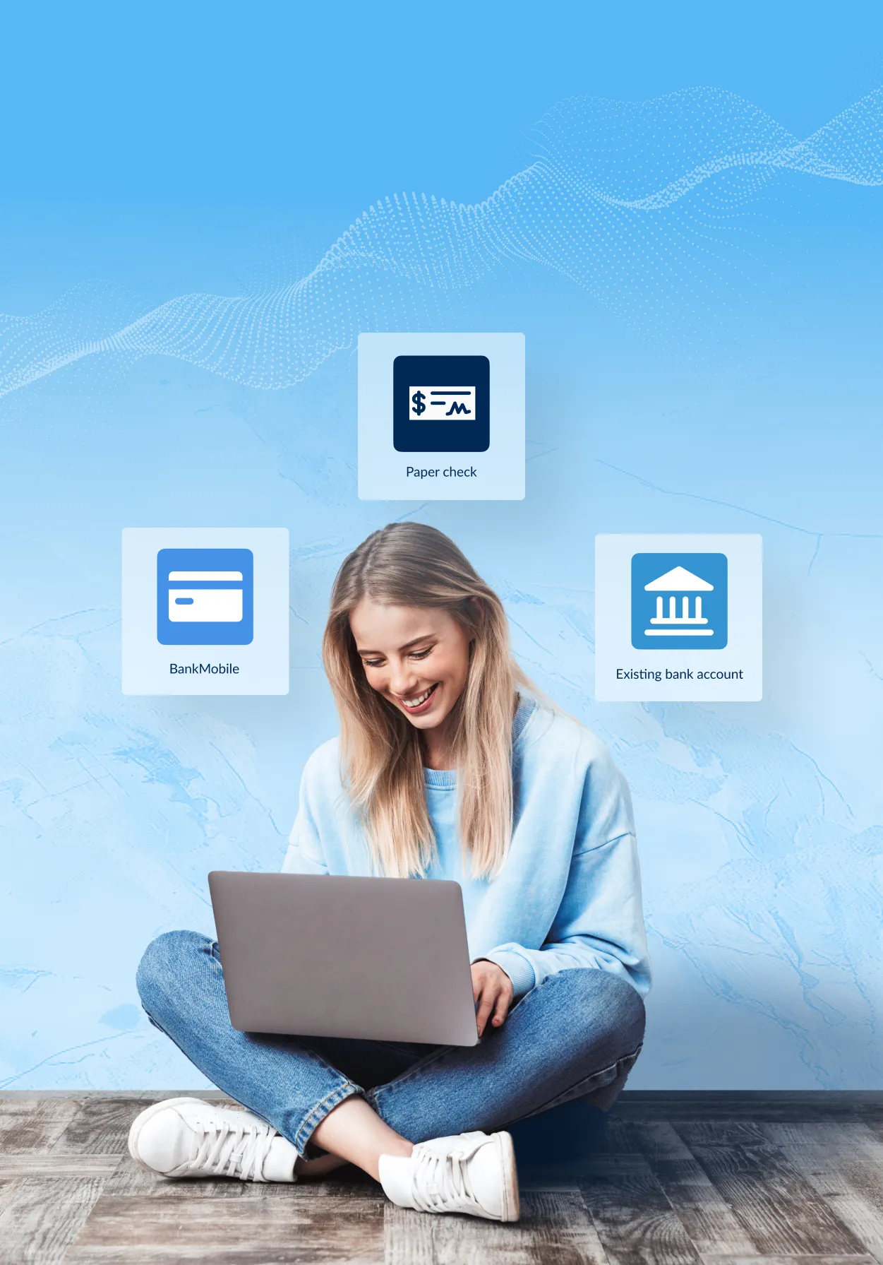 Student female sitting crosslegged on the floor with her laptop in her lap