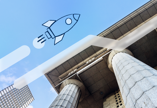 Illustrated rocket flying across a blue sky above a bank with columns.