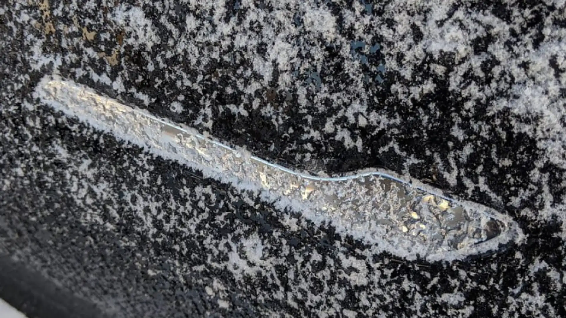 Frozen Tesla's flush door handle in the winter