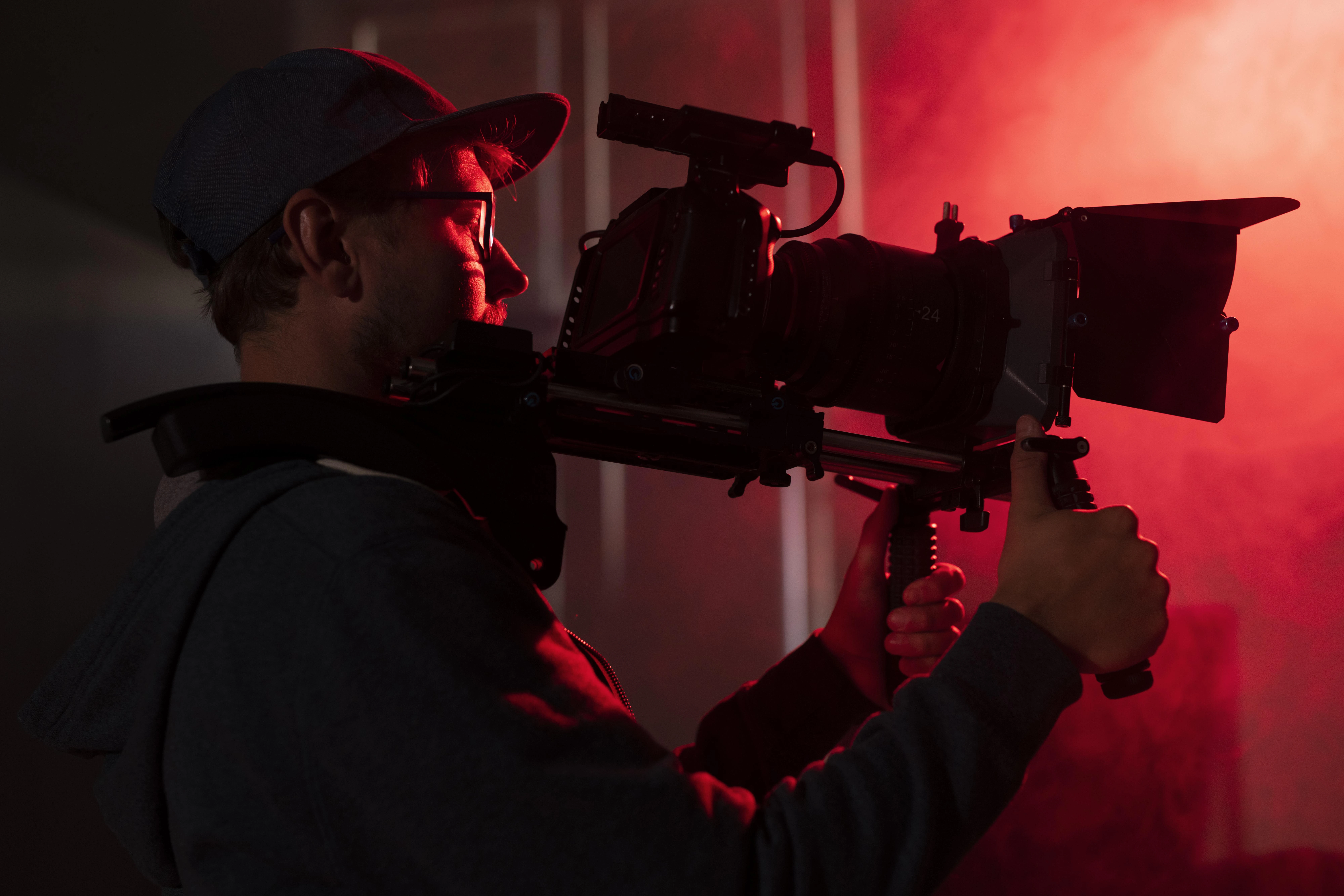 Cinematographer with a large camera in hand