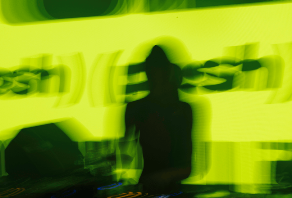 Blurred green-lit silhouette of a DJ before 'Posh' branding