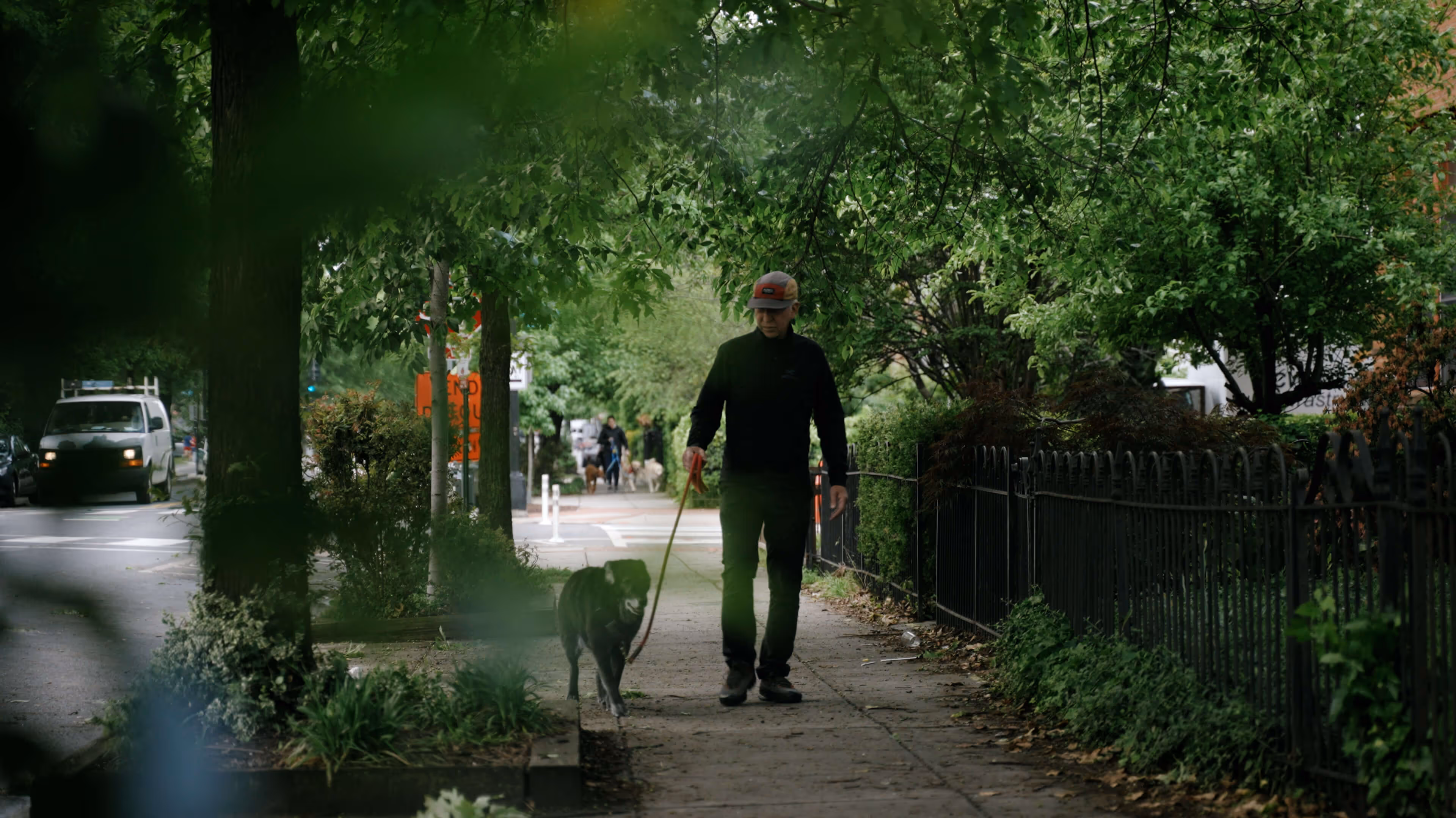 Man walking his dog in a documentary project by Colt Bradley