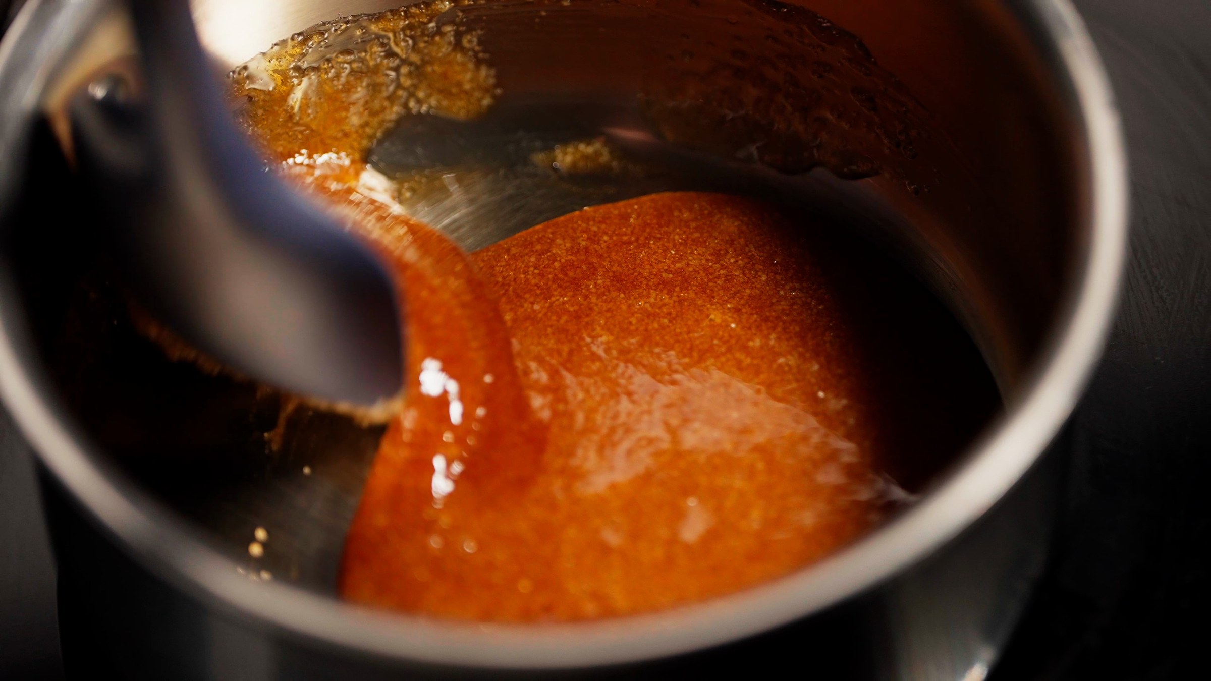 Caramel cooking in a copper pan
