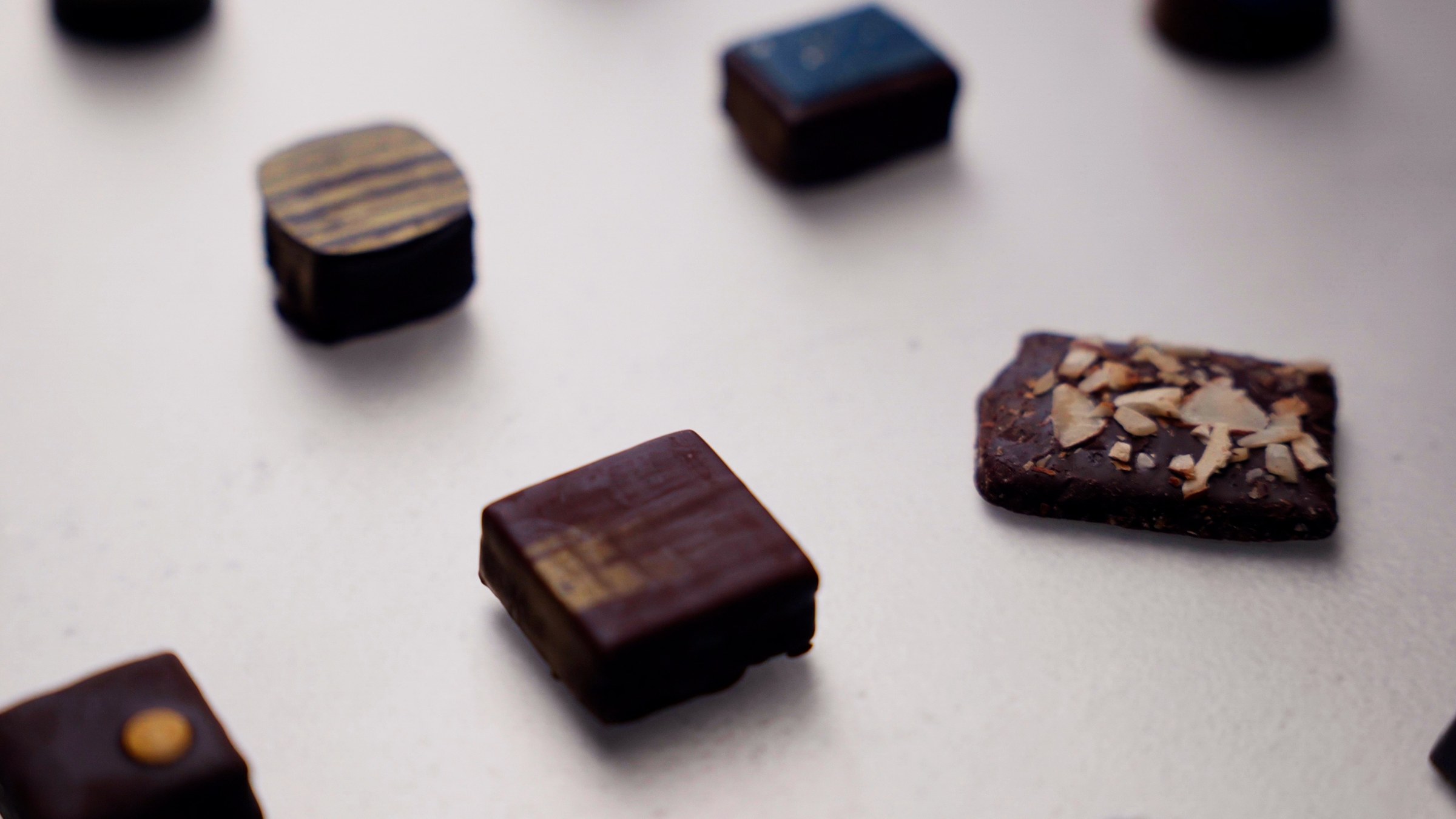 Finished bonbons and caramels arranged on marble