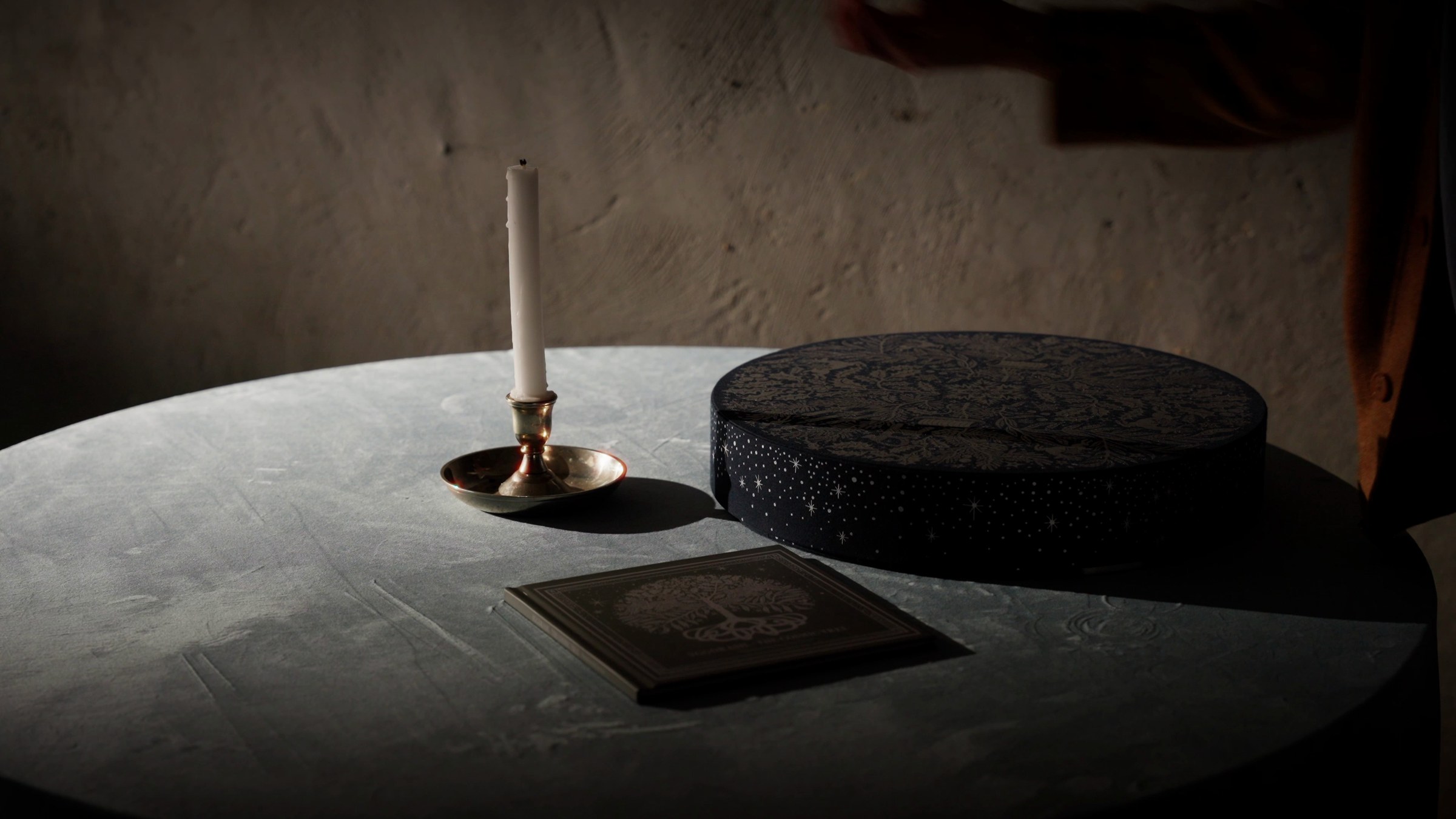Candlelit table set with the Dandelion Advent Calendar