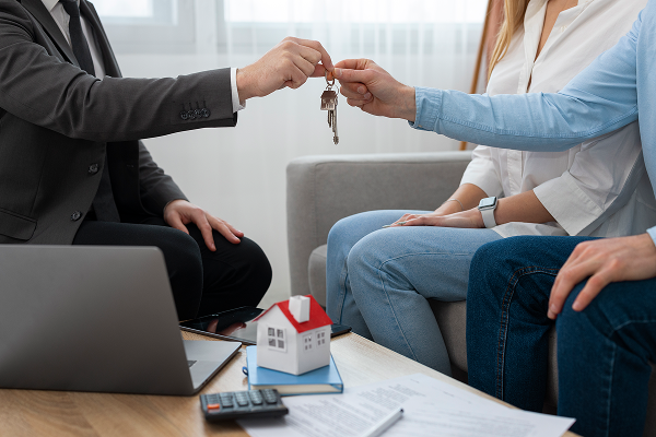 A real estate transaction, owners getting the keys to their home.