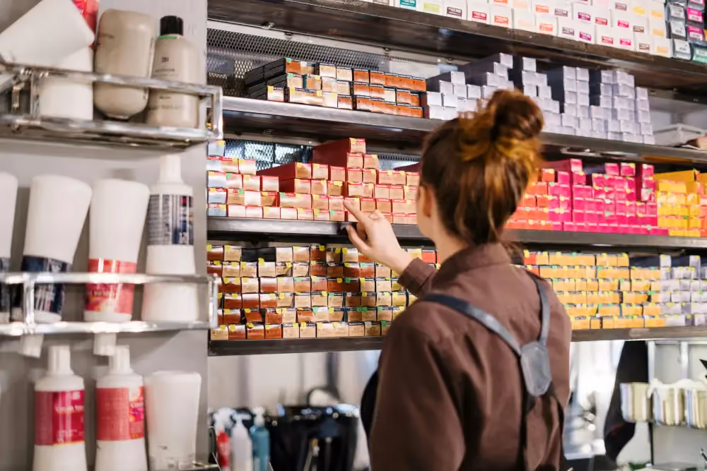 Shopper scanning a crowded supermarket shelf where packaging designs blend together