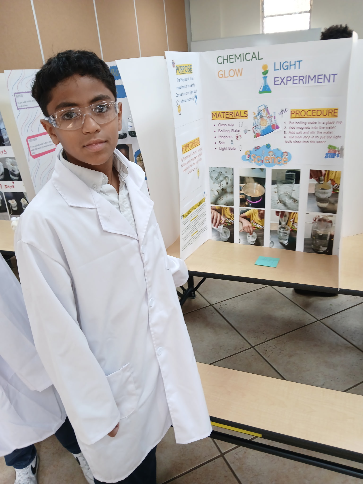 Student displaying project at the 5th Grade Science Fair