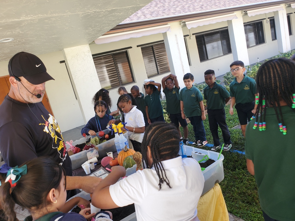 GABIE Onsite Trip, 2nd grade planting different seeds while learning about the plant life cycle
