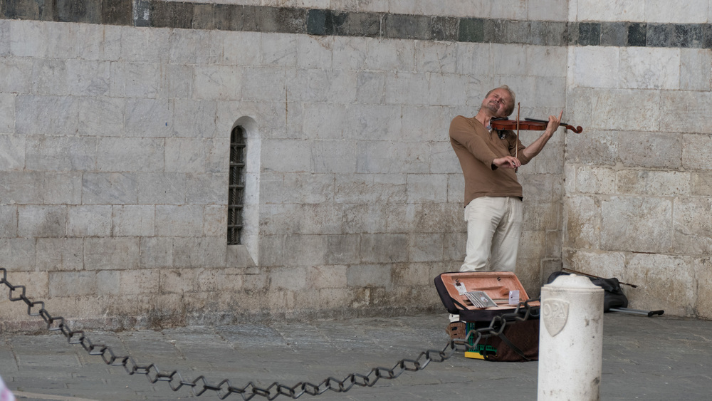 Unknown Street Musician on streets of Siena.