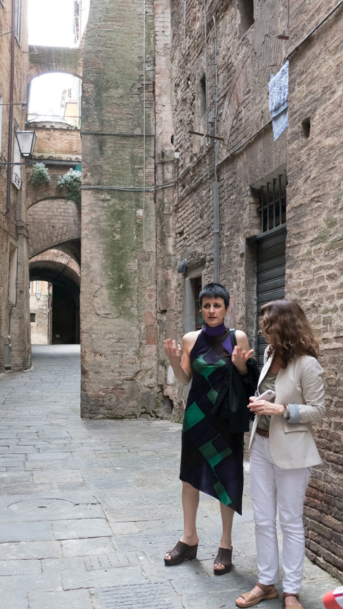 Franca Marini giving the group a tour through the narrow residential streets of Siena.